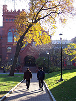 two people walking on path toward Durham Wing