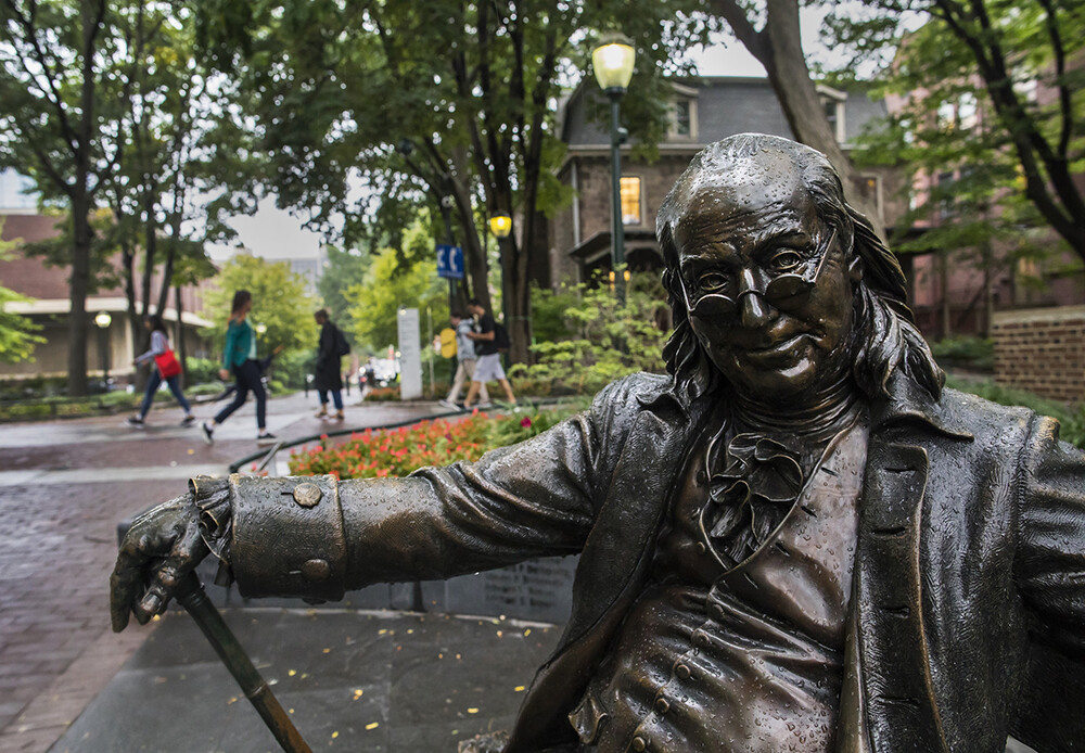 campus landmark: bronze Ben Franklin sitting on a bench